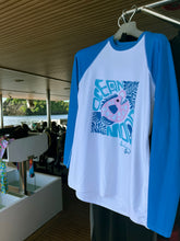 Load image into Gallery viewer, Ocean Mood rash guard drying on a scuba diving boat, showing fun ocean-inspired design made for active water adventures