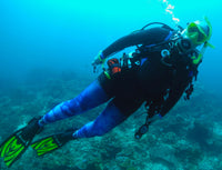 Woman scuba diver in jellyfish leggings and Truli wetsuit