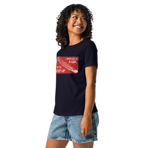 Woman wearing navy scuba diving t-shirt with vintage dive flag design with denim shorts, casual ocean-inspired outfit by Scuba Sisters
